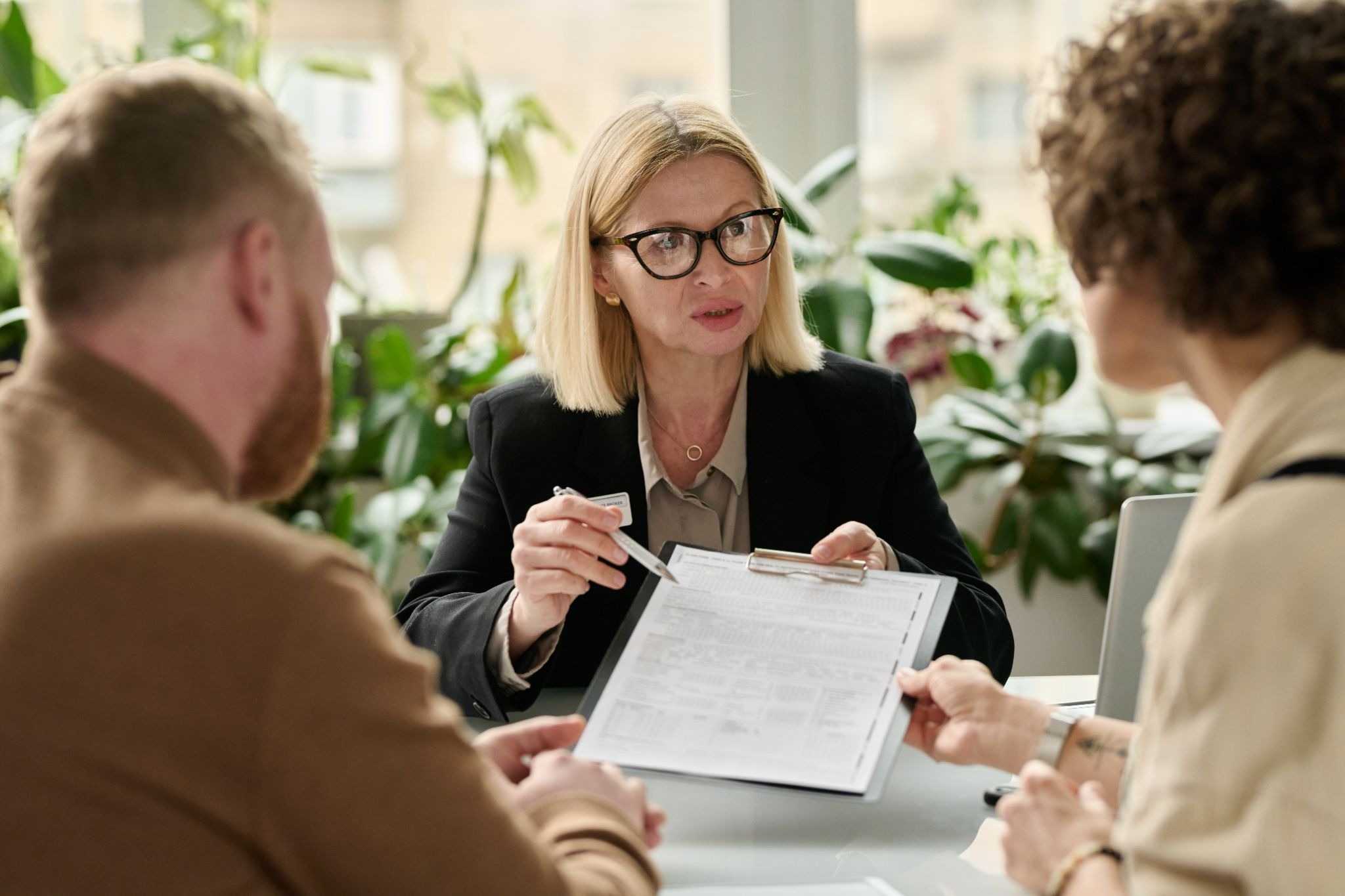 Adoption lawyer reviewing legal documents with clients during adoption consultation in Central Missouri
