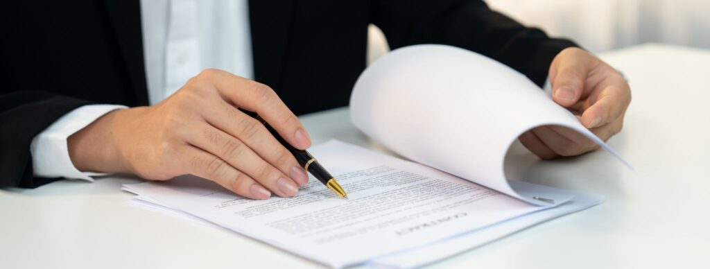 Attorney reviewing Missouri liquor license application documents to ensure compliance with Division of Alcohol and Tobacco Control requirements