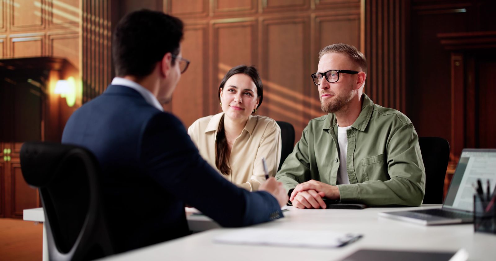 Couple meeting with divorce trial attorney to discuss contested divorce proceedings and legal strategy at Brydon Swearengen England Jefferson City Missouri